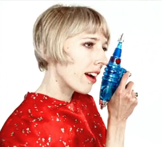 A photo of a woman with a laser gun on a white background